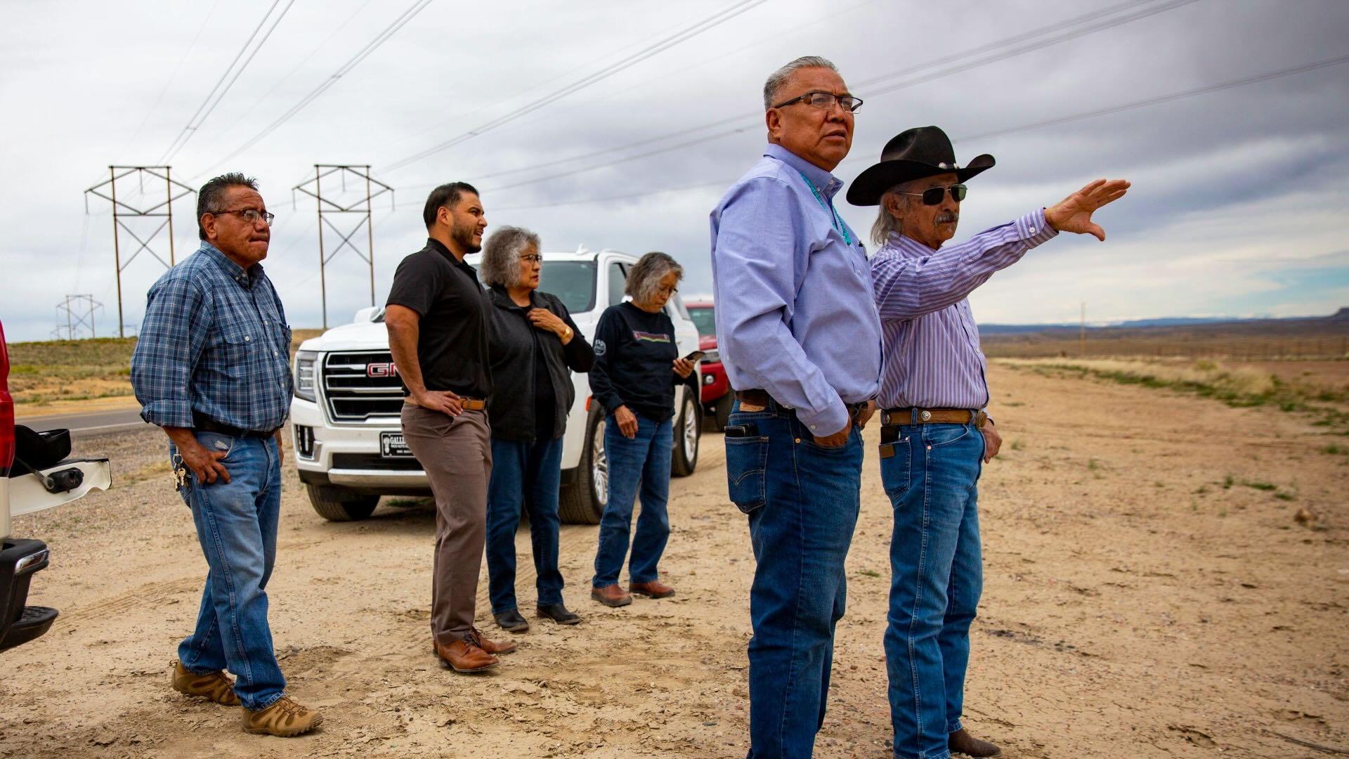 Nenahnezad Chapter President Norman C. Begaye, front left, and former Navajo Nation Council Delegate George Arthur, right, are joined by chapter officials as they talk about the proposed site of a 1 gigawatt solar, wind and battery-storage project in Nenahnezad, N.M. on Thursday, April 13, 2023.