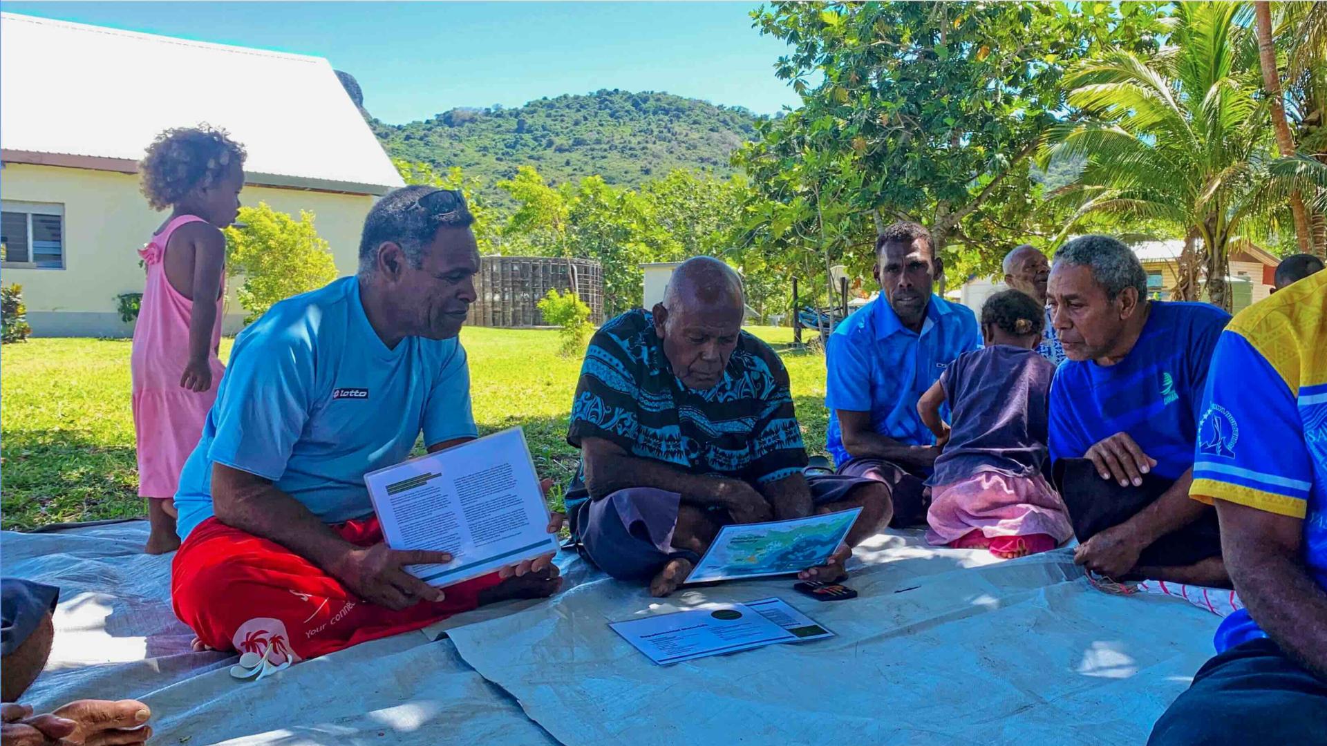 Group of community members discussing the project.